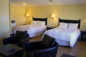 Hypo-allergenic bedding, desk, laptop workspace, blackout drapes