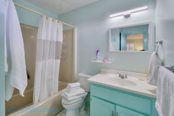 Master bathroom with a tub shower combo