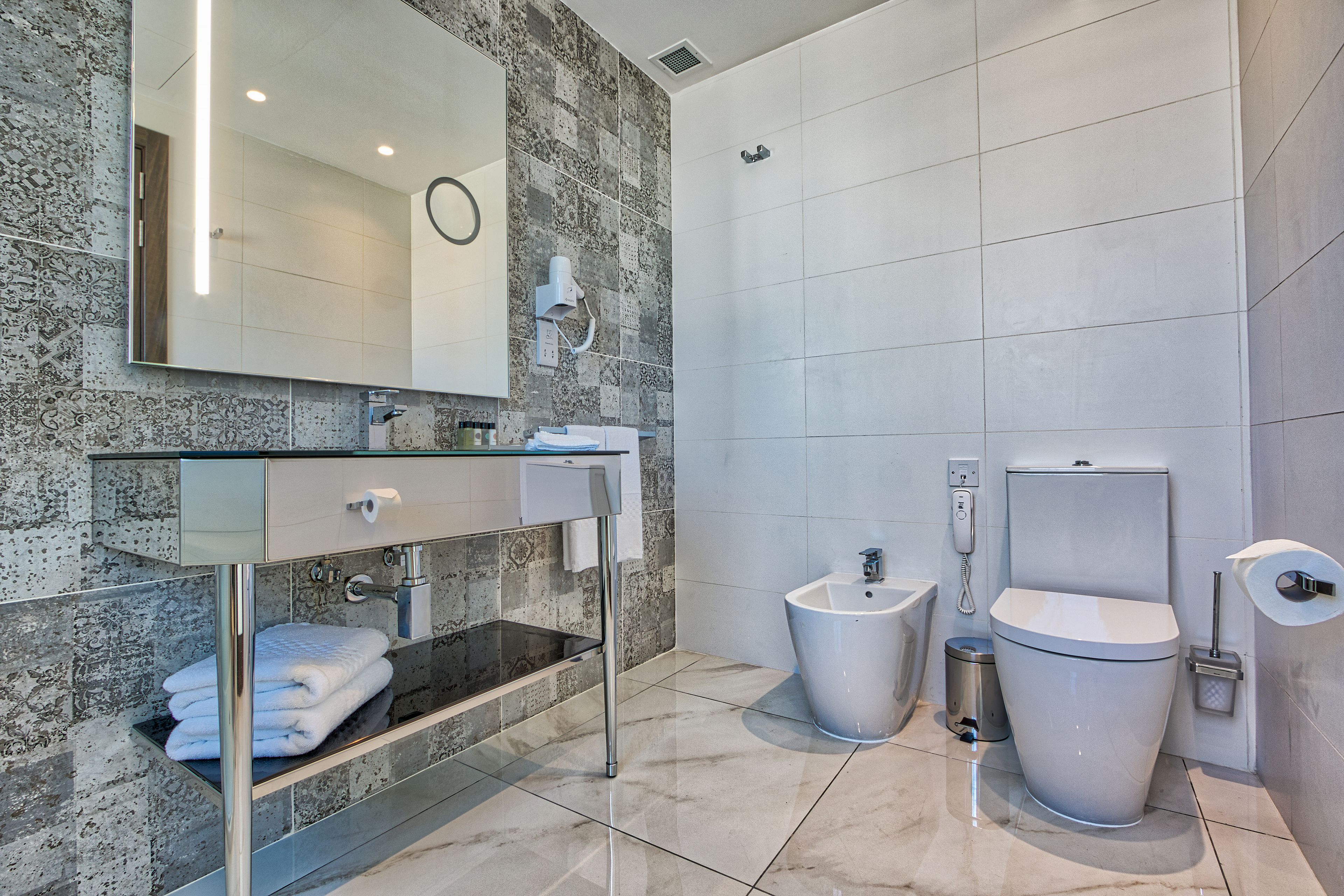 suite, jetted tub | bathroom | free toiletries, hair dryer, bathrobes, slippers