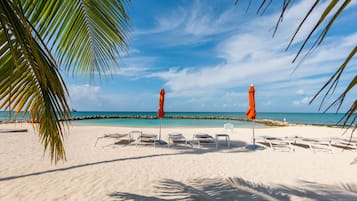 On the beach, sun loungers, beach towels