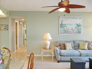 Condo, Multiple Beds (Tradewinds 410) | Living room | TV, books - Tradewinds 410 (Marco Island)