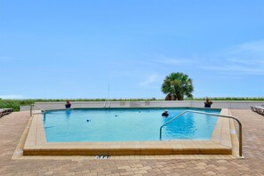 Condo, Multiple Beds (Tradewinds 410) | Pool | A heated pool, sun loungers