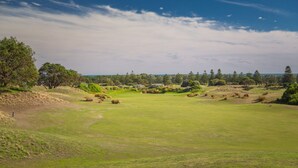 A golf course with a clear view of the green, sand bunkers, and trees. - Time Away - 50 Turnberry Drive (Normanville)