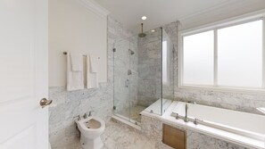 Bathtub, hair dryer, towels, soap