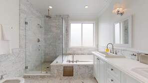 Bathtub, hair dryer, towels, soap