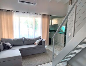 Standard Apartment, 2 Bedrooms | Living area | 55-inch Smart TV with digital channels, TV, Netflix - Cozy one-bedroom & mezzanine apartment (Philipsburg)