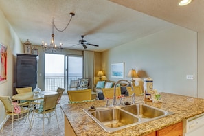 Enjoy cooking and dining in this spacious kitchen with a large island, double sink, and oven.