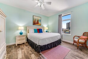Relax in a stylish room with a large bed, bedside tables, and a city view.