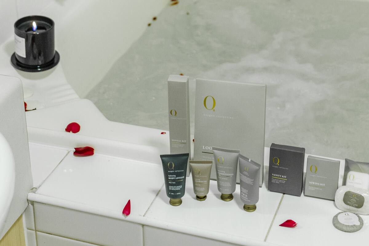Bathtub, hair dryer, towels, soap