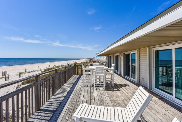 Outdoor dining - LET YOUR CARES DRIFT AWAY as you watch the dolphins play from the newly expanded beachfront deck. (St. George Island)