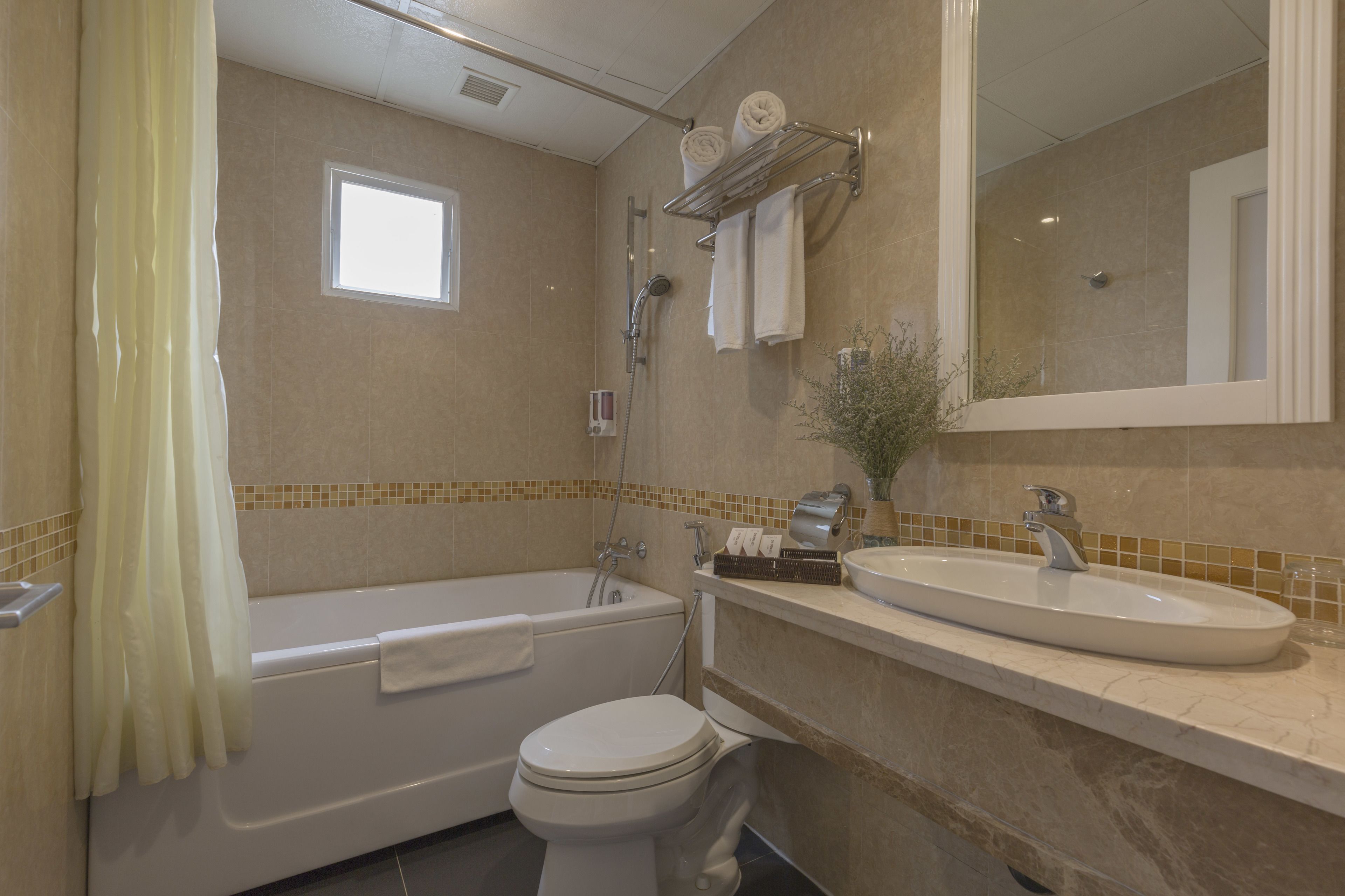 deluxe double room | bathroom | bathtub, free toiletries, hair dryer, slippers