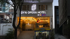The exterior of the DYN OPERA HOTEL, featuring a modern design with a prominent entrance and signage. - Dyn Opera Hotel (Ho Chi Minh City)