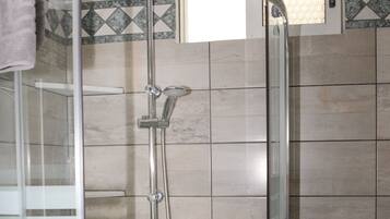 Shower, hair dryer, towels, soap