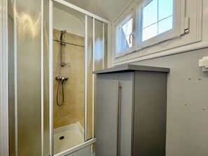 Shower, hair dryer, towels, toilet paper