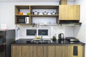 Deluxe Studio | Private kitchenette | Full-size fridge, microwave, stovetop