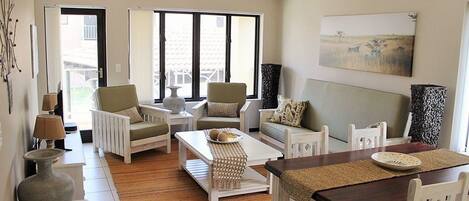 Family Apartment, Non Smoking, Pool Access | Living area | 40-inch Smart TV with satellite channels, TV, Netflix