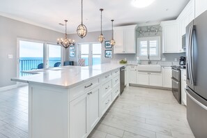 Enjoy cooking with a large island and ample counter space, stainless steel appliances, and ocean views.
