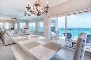 Relax in this serene space with a large sofa, coffee table, and ocean views.