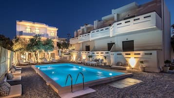 Seasonal outdoor pool, open 9:00 AM to 8:00 PM, pool umbrellas