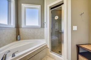 Combined shower/bathtub, towels, soap, shampoo