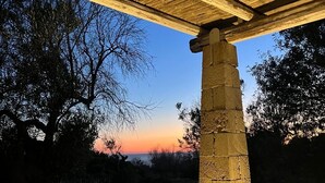A stone pillar under a wooden pergola at dusk. - SAN GREGORIO VILLA WITH SECULAR OLIVE GROVE, GARDEN AND PORCH (Patù)