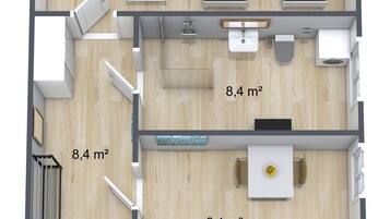 Pianta del pavimento di una camera d'albergo con camera da letto, bagno e angolo cottura. La camera dispone di due letti, un bagno piccolo e un angolo cottura. La superficie totale della stanza è di 14,6 m².