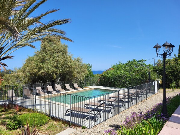 Seasonal outdoor pool, pool loungers