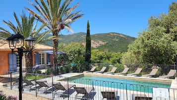 Seasonal outdoor pool, pool loungers
