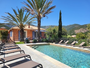 Seasonal outdoor pool, pool loungers
