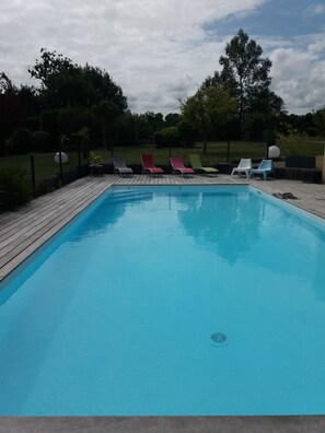 Seasonal outdoor pool, open 10:30 AM to 7:30 PM, pool umbrellas
