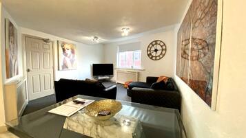 Apartemen | Area keluarga | TV layar datar