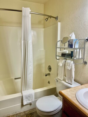 Combined shower/tub, hair dryer, towels, soap