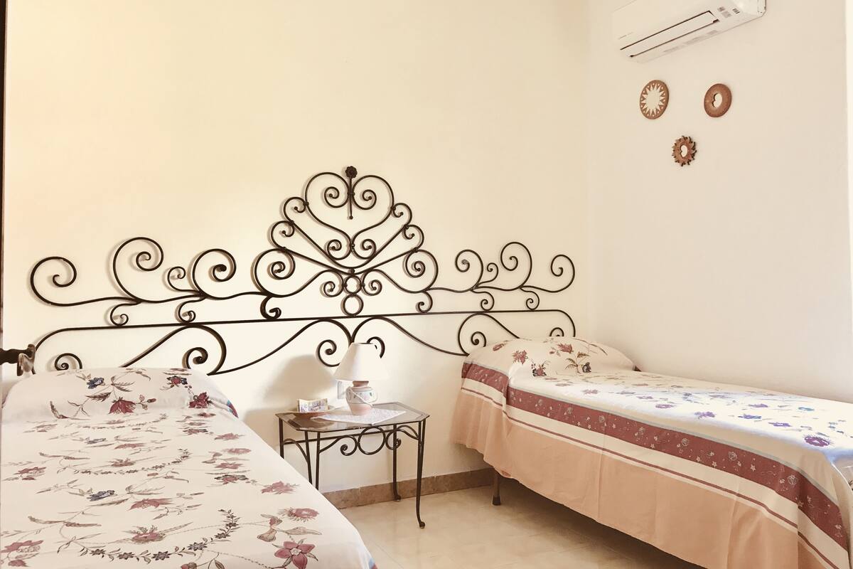Premium bedding, individually decorated, laptop workspace, rollaway beds