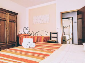 Premium bedding, individually decorated, laptop workspace, rollaway beds