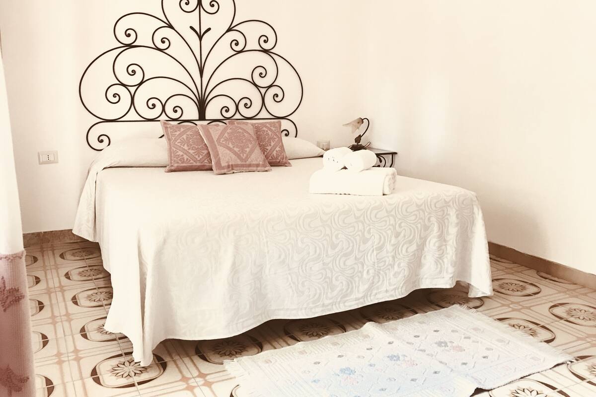 Premium bedding, individually decorated, laptop workspace, rollaway beds