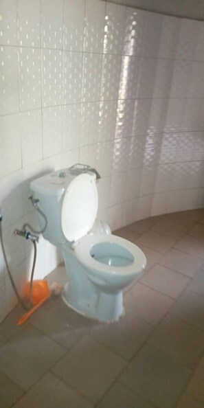 Standard Triple Room | Bathroom | Shower, towels, soap, toilet paper - Soleil D' Espoir (Niaga)