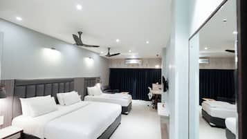 Superior Triple Room, Garden View | Pillow-top beds, desk, laptop workspace