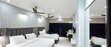 Superior Triple Room, Garden View | Pillowtop beds, desk, laptop workspace