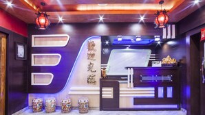 A reception area with a modern design, featuring a reception desk, decorative lanterns, and a marble floor. - Hotel Lee Garden, Near Blue Flag Beach(500 Mtrs), Puri (Puri)