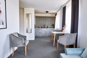 Business Apartment, Multiple Beds, City View | Living area | LCD TV