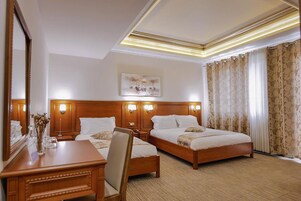 Premium bedding, down comforters, minibar, in-room safe
