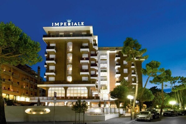 A multi-story hotel named "Imperiale" with a modern architectural design, featuring balconies and a prominent entrance. - Hotel Imperiale (Cervia)
