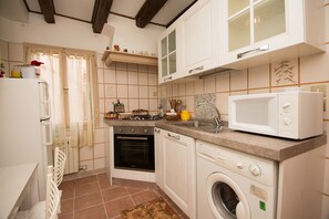 Apartment, 2 Bedrooms, City View | Private kitchen | Full-size fridge, microwave, stovetop, dishwasher - Grimaldi Apartments - San Marco Economy (Venice)