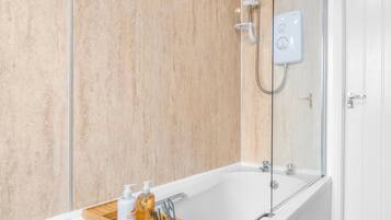 Bathtub, hair dryer, towels