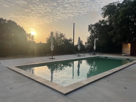 Seasonal outdoor pool, open 10:00 AM to 8:00 PM, pool umbrellas