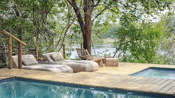 Outdoor pool, pool umbrellas, sun loungers