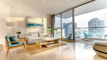 Deluxe Apartment, 2 Bedrooms, Ocean View | Living area | 49-inch Smart TV with satellite channels, TV
