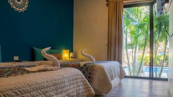 Superior Quadruple Room | Down comforters, minibar, in-room safe, individually decorated
