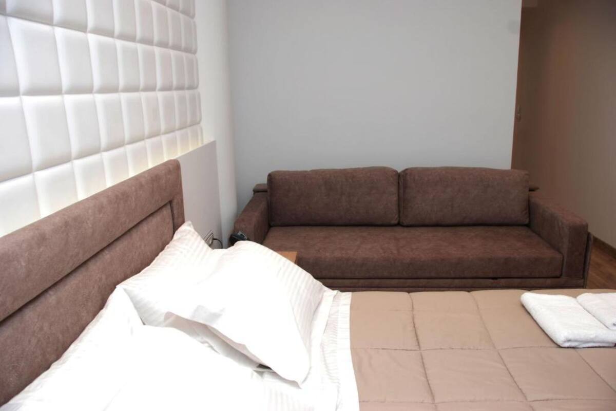 Deluxe Quadruple Room, Pool View | In-room safe, soundproofing, WiFi (free), bed sheets