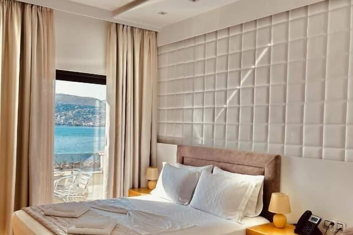 Deluxe Triple Room, Sea View | 1 bedroom, in-room safe, soundproofing, free WiFi